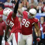 Arizona Cardinals outside linebacker Chandler Jones (55) celebrates a tackle against the Tennessee Titans with inside linebacker Kareem Martin (96) during the first half of an NFL football game, Sunday, Dec.10, 2017, in Glendale, Ariz. (AP Photo/Rick Scuteri)
