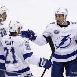 Tampa Bay Lightning center Brayden Point (21) celebrates his goal against the Arizona Coyotes with left wing Ondrej Palat (18) and center Tyler Johnson (9) during the first period of an NHL hockey game, Thursday, Dec. 14, 2017, in Glendale, Ariz. (AP Photo/Ross D. Franklin)