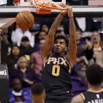 Phoenix Suns forward Marquese Chriss (0) dunks against the Washington Wizards during the first half of an NBA basketball game, Thursday, Dec. 7, 2017, in Phoenix. (AP Photo/Matt York)