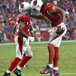 Arizona Cardinals wide receiver Larry Fitzgerald (11) celebrates his touchdown with running back Kerwynn Williams (33) during the first half of an NFL football game against the Los Angeles Rams, Sunday, Dec. 3, 2017, in Glendale, Ariz. (AP Photo/Ross D. Franklin)