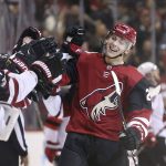 Arizona Coyotes' Dylan Strome, right, is congratulated by teammates after scoring a goal against the New Jersey Devils during the third period of an NHL hockey game, Saturday, Dec. 2, 2017, in Glendale, Ariz. The goal was Strome's first career NHL goal. The Coyotes defeated the Devils 5-0. (AP Photo/Ralph Freso)