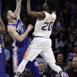 Phoenix Suns' Josh Jackson, right, goes up to shoot against Philadelphia 76ers' JJ Redick during the first half of an NBA basketball game, Monday, Dec. 4, 2017, in Philadelphia. (AP Photo/Matt Slocum)