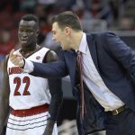 Louisville interim head coach David Padgett, right, talks with forward Deng Adel (22) during the first half of an NCAA college basketball game against Grand Canyon, Saturday, Dec. 23, 2017, in Louisville, Ky. (AP Photo/Timothy D. Easley)