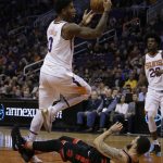 Phoenix Suns forward Marquese Chriss (0) gets fouled by Toronto Raptors guard Fred VanVleet in the fourth quarter during an NBA basketball game, Wednesday, Dec 13, 2017, in Phoenix. The Raptors defeated the Suns 115-109. (AP Photo/Rick Scuteri)
