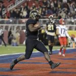 Purdue running back D.J. Knox runs in for a touchdown against Arizona during the first half of the Foster Farms Bowl NCAA college football game Wednesday, Dec. 27, 2017, in Santa Clara, Calif. (AP Photo/Marcio Jose Sanchez)