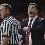 Arizona coach Sean Miller, right, voices his opinion toward an official after a call during the first half of the team's NCAA college basketball game against Arizona State, Saturday, Dec. 30, 2017, in Tucson, Ariz. (AP Photo/Ralph Freso)