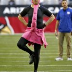 Arizona Cardinals quarterback Carson Palmer wears a pink flamingo suit after losing the weekly quarterback challenge prior to an NFL football game against the New York Giants, Sunday, Dec. 24, 2017, in Glendale, Ariz. (AP Photo/Ross D. Franklin)