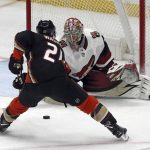 Arizona Coyotes goalie Antti Raanta (32) defends as Anaheim Ducks center Chris Wagner (21) attacks in the third period of an NHL hockey game in Anaheim, Calif., Sunday, Dec. 31, 2017. (AP Photo/Reed Saxon)