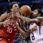 Toronto Raptors guard DeMar DeRozan (10) tries to drive to the net as Phoenix Suns guard Tyler Ulis (8) defends during the second half of an NBA basketball game Tuesday, Dec. 5, 2017, in Toronto. (Nathan Denette/The Canadian Press via AP)
