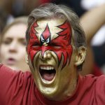 An Arizona Cardinals fan cheers for his team during the first half of an NFL football game against the Tennessee Titans, Sunday, Dec. 10, 2017, in Glendale, Ariz. (AP Photo/Ralph Freso)