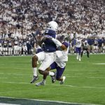 Penn State wide receiver DaeSean Hamilton (5) pulls in a touchdown catch as Washington defensive back Myles Bryant defends during the second half of the Fiesta Bowl NCAA college football game, Saturday, Dec. 30, 2017, in Glendale, Ariz. (AP Photo/Ross D. Franklin)