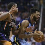Memphis Grizzlies guard Andrew Harrison, right, reacts as Phoenix Suns' Isaiah Canaan reaches in for the ball during the second half of an NBA basketball game Thursday, Dec. 21, 2017, in Phoenix. The Suns defeated the Grizzlies 97-95. (AP Photo/Ralph Freso)