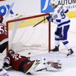 Tampa Bay Lightning center Vladislav Namestnikov (90) taps the puck in for a goal against Arizona Coyotes goalie Antti Raanta (32) as Coyotes defenseman Jason Demers (55) looks on during the first period of an NHL hockey game, Thursday, Dec. 14, 2017, in Glendale, Ariz. (AP Photo/Ross D. Franklin)