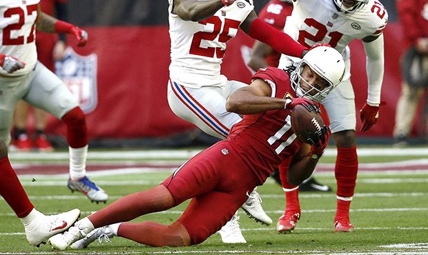 Arizona Cardinals wide receiver Larry Fitzgerald (11) makes a catch as New York Giants defensive ba...