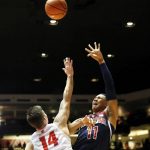 Arizona's Ira Lee, right, shoots the ball over New Mexico's Dane Kuiper in the first half of an NCAA college basketball game, Saturday, Dec. 16, 2017, in Albuquerque, N.M. (AP Photo/Eric Draper)