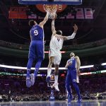 Phoenix Suns' Tyson Chandler (4) goes up for a dunk against Philadelphia 76ers' Dario Saric (9) during the first half of an NBA basketball game, Monday, Dec. 4, 2017, in Philadelphia. (AP Photo/Matt Slocum)
