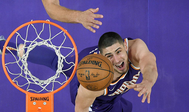 Phoenix Suns center Alex Len, of Ukraine, shoots during the first half of an NBA basketball game ag...