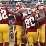 Washington Redskins wide receiver Jamison Crowder (80) is congratulated by teammates after pulling in a touchdown pass during the first half of an NFL football game against Arizona Cardinals in Landover, Md., Sunday, Dec 17, 2017. (AP Photo/Alex Brandon)