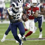 Los Angeles Rams inside linebacker Alec Ogletree (52) runs back an interception for a touchdown against the Arizona Cardinals during the first half of an NFL football game, Sunday, Dec. 3, 2017, in Glendale, Ariz. (AP Photo/Ross D. Franklin)