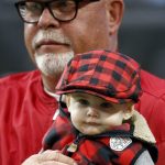 Arizona Cardinals head coach Bruce Arians holds his grandson Asher prior to an NFL football game against the New York Giants, Sunday, Dec. 24, 2017, in Glendale, Ariz. (AP Photo/Ross D. Franklin)