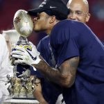 Penn State safety Marcus Allen kisses the trophy after Penn State defeated Washington 35-28 in the Fiesta Bowl NCAA college football game Saturday, Dec. 30, 2017, in Glendale, Ariz. (AP Photo/Rick Scuteri)