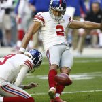 New York Giants kicker Aldrick Rosas (2) unsuccessfully attempts a field goal as punter Brad Wing (9) holds during the first half of an NFL football game against the Arizona Cardinals, Sunday, Dec. 24, 2017, in Glendale, Ariz. (AP Photo/Ross D. Franklin)