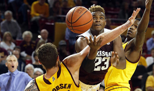 Texas A&M guard Danuel House (23) is called for the offensive foul on Arizona State forward Eric Ja...