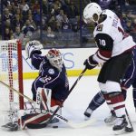 Columbus Blue Jackets' Sergei Bobrovsky, left, of Russia, makes a save against Arizona Coyotes' Anthony Duclair during the first period of an NHL hockey game Saturday, Dec. 9, 2017, in Columbus, Ohio. (AP Photo/Jay LaPrete)
