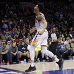 Phoenix Suns' Devin Booker (1) reacts after a dunk during the second half of an NBA basketball game against the Philadelphia 76ers, Monday, Dec. 4, 2017, in Philadelphia. Phoenix won 115-101. (AP Photo/Matt Slocum)