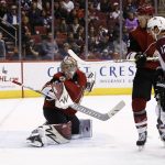 Arizona Coyotes goalie Antti Raanta, left, gives up a goal to Colorado Avalanche center Carl Soderberg as Coyotes right wing Christian Fischer, second from right, and Avalanche defenseman Patrik Nemeth (12) watch during the second period of an NHL hockey game Saturday, Dec. 23, 2017, in Glendale, Ariz. (AP Photo/Ross D. Franklin)