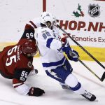 Arizona Coyotes defenseman Jason Demers (55) and Tampa Bay Lightning right wing Nikita Kucherov (86) collide as they go after the puck during the second period of an NHL hockey game, Thursday, Dec. 14, 2017, in Glendale, Ariz. (AP Photo/Ross D. Franklin)