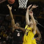 Pacific forward Jahlil Tripp (0) shoots between Arizona State forward Romello White and Arizona State guard Kodi Justice (44) in the first half during an NCAA college basketball game, Friday, Dec 22, 2017, in Tempe, Ariz. (AP Photo/Rick Scuteri)