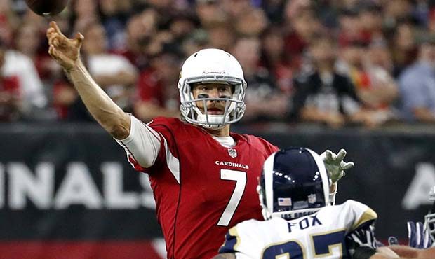 Arizona Cardinals quarterback Blaine Gabbert (7) throws as Los Angeles Rams defensive end Morgan Fo...