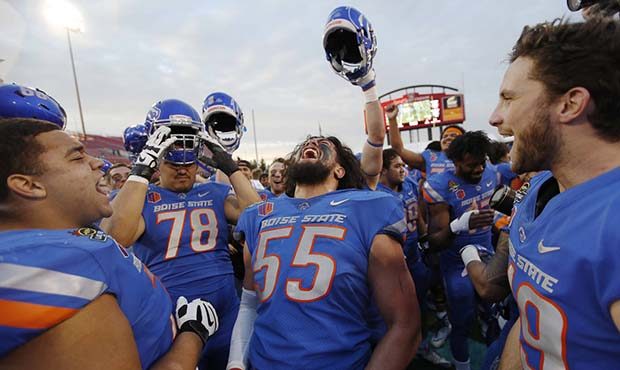 Boise State players celebrate after defeating Oregon in the Las Vegas Bowl NCAA college football ga...