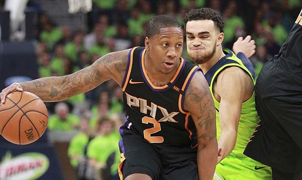 Phoenix Suns guard Isaiah Canaan (2) drives against Minnesota Timberwolves guard Tyus Jones (1) in ...