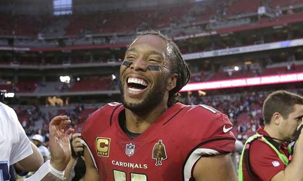 Arizona Cardinals wide receiver Larry Fitzgerald (11) laughs as he talks with Tennessee Titans quar...