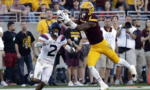 Arizona State wide receiver N'Keal Harry, right, makes the catch in front of Arizona cornerback Lor...