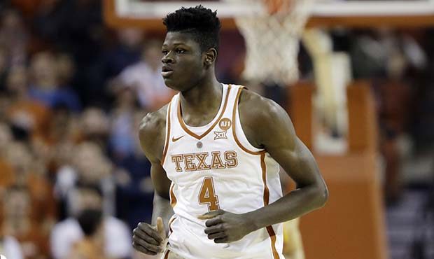 Texas forward Mohamed Bamba (4) runs up court during the first half of an NCAA college basketball g...