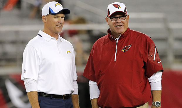 Arizona Cardinals head coach Bruce Arians, right, talks with San Diego Chargers offensive coordinat...