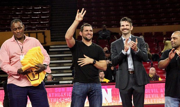 Former UFC welterweight and ASU wrestler Aaron Simpson “flashes the fork” to fans at ASU’s th...