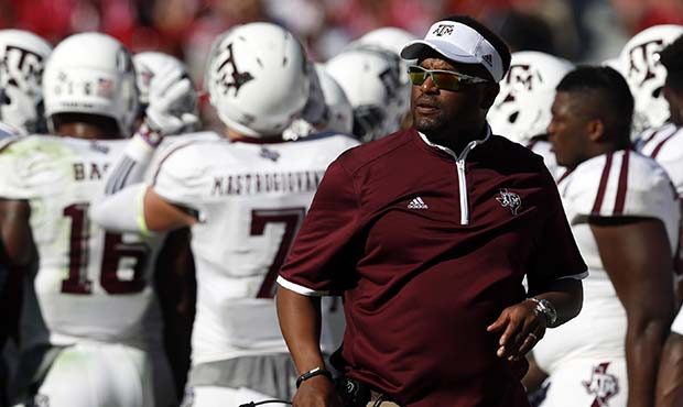 Texas A&M head coach Kevin Sumlin walks the sideline during the first half of an NCAA college f...