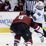 San Jose Sharks center Logan Couture (39) shoots in front of Arizona Coyotes right wing Tobias Rieder in the first period during an NHL hockey game, Tuesday, Jan. 16, 2018, in Glendale, Ariz. (AP Photo/Rick Scuteri)