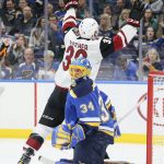 Arizona Coyotes right wing Christian Fischer, top, reacts after scoring against St. Louis Blues goaltender Jake Allen, bottom, in the second period of an NHL hockey game Saturday, Jan. 20, 2018, in St. Louis. (Chris Lee/St. Louis Post-Dispatch via AP)