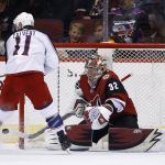 Arizona Coyotes goaltender Antti Raanta (32) makes a save on a shot by Columbus Blue Jackets left wing Matt Calvert (11) during the second period of an NHL hockey game, Thursday, Jan. 25, 2018, in Glendale, Ariz. (AP Photo/Ross D. Franklin)