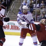 Arizona Coyotes goaltender Antti Raanta (32) makes the save in front of New York Rangers center Vinni Lettieri in the third period during an NHL hockey game, Saturday, Jan. 6, 2018, in Glendale, Ariz. (AP Photo/Rick Scuteri)
