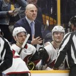 Arizona Coyotes coach Rick Tocchet, center, argues a call during the third period of the team's NHL hockey game against the Nashville Predators on Thursday, Jan. 18, 2018, in Nashville, Tenn. The Predators won in a shootout, 3-2. (AP Photo/Mark Humphrey)