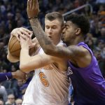 New York Knicks forward Kristaps Porzingis (6) collides with Phoenix Suns forward Marquese Chriss during the first half of an NBA basketball game Friday, Jan. 26, 2018, in Phoenix. (AP Photo/Rick Scuteri)