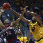 California's Kingsley Okoroh, right, blocks the shot of Arizona's Allonzo Trier (35) in the second half of an NCAA college basketball game Wednesday, Jan. 17, 2018, in Berkeley, Calif. (AP Photo/Ben Margot)
