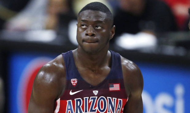 Arizona guard Rawle Alkins reacts after getting called for his fourth personal foul while facing Co...