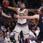 Arizona State forward Mickey Mitchell shoots as Utah forward Donnie Tillman, rear, defends during the second half of an NCAA college basketball game Thursday, Jan. 25, 2018, in Tempe, Ariz. Utah won 80-77 in overtime. (AP Photo/Matt York)